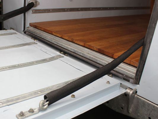 Cover for tailgate chain, black vinyl.